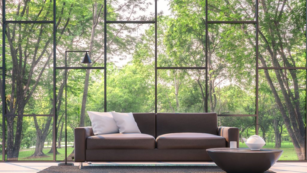 Floor-to-ceiling windows bringing natural light and outdoor views indoors
