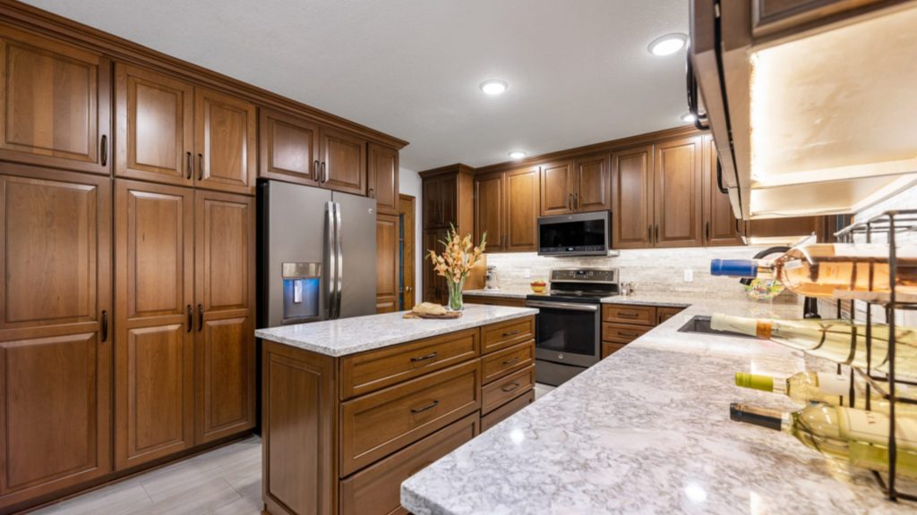 Traditional enclosed kitchen with classic cabinetry, defined walls, and separated layout from dining and living areas