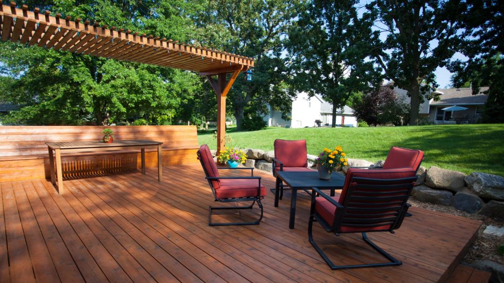 All-weather covered deck providing shade and comfort Covered deck with comfortable outdoor seating