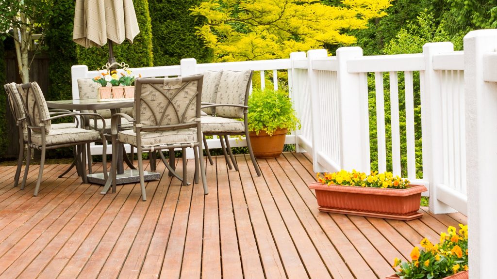 Elegant covered deck blending comfort and style Stylish covered deck with coordinated outdoor furniture