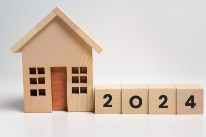 2024-wooden-cubes-box-house-white-background-real-estate Roofing Trends in 2024