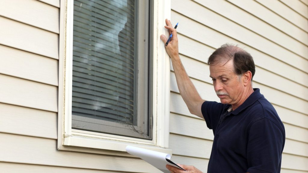 Inspecting and adjusting the window installation.